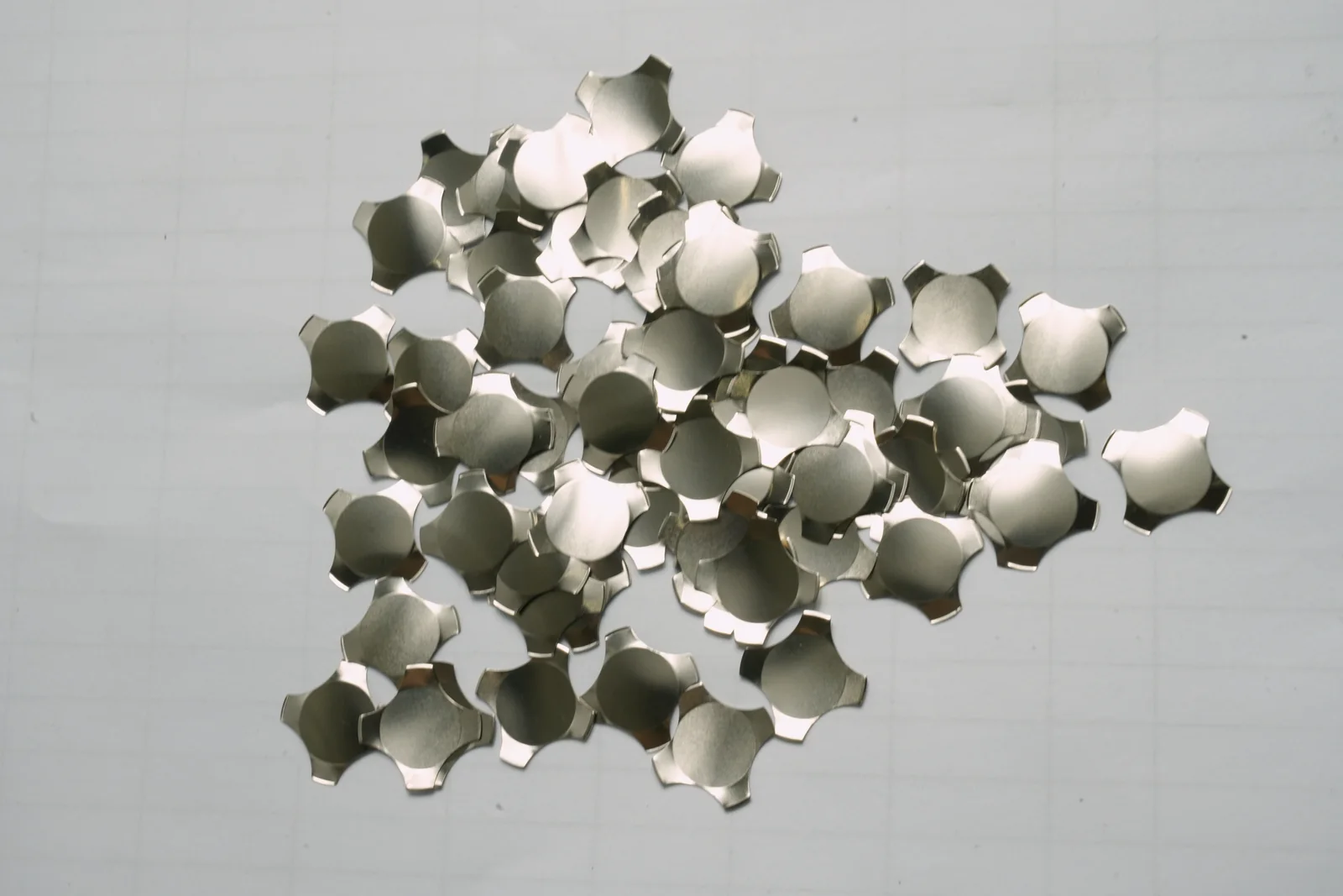 Loose tactile metal dome components shown from above
