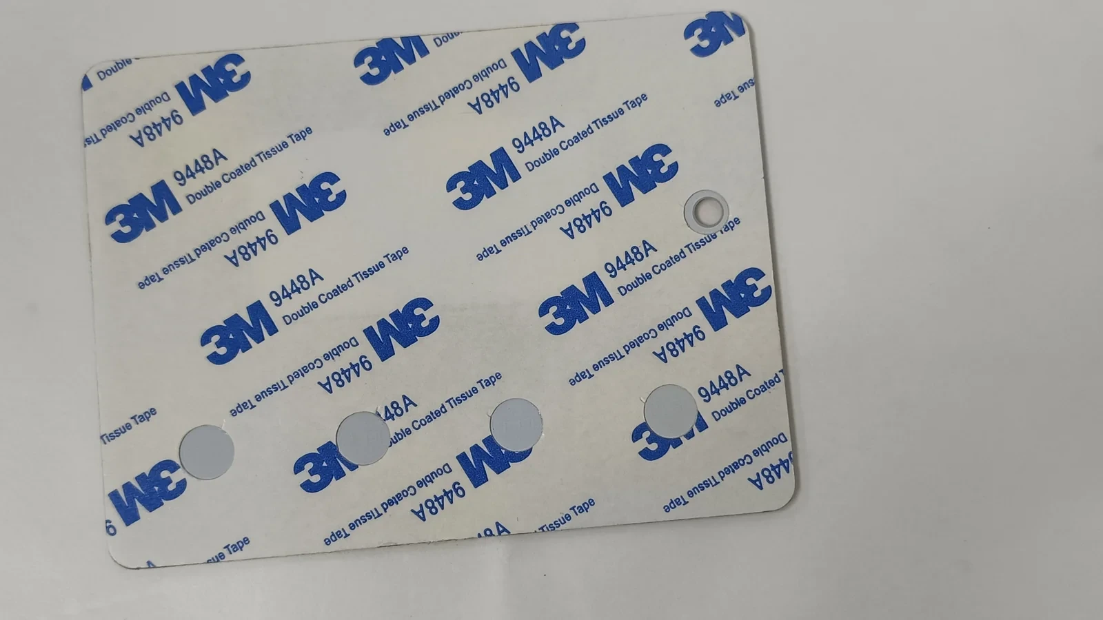 Die-cut 3M 9448A adhesive layer with a circular opening