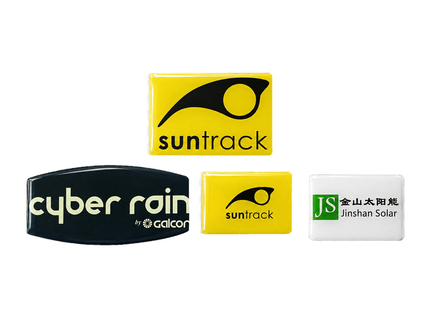 Four custom clear-resin doming label nameplate samples with printed brand graphics