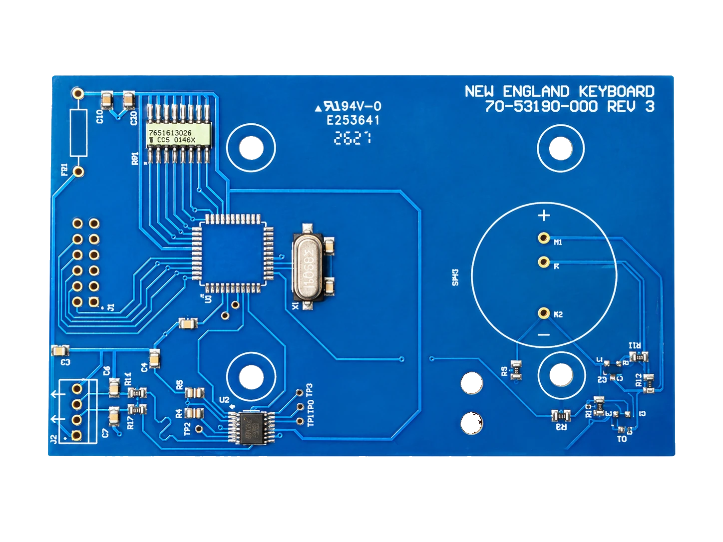 Blue populated printed circuit board with integrated components, test points and mounting holes