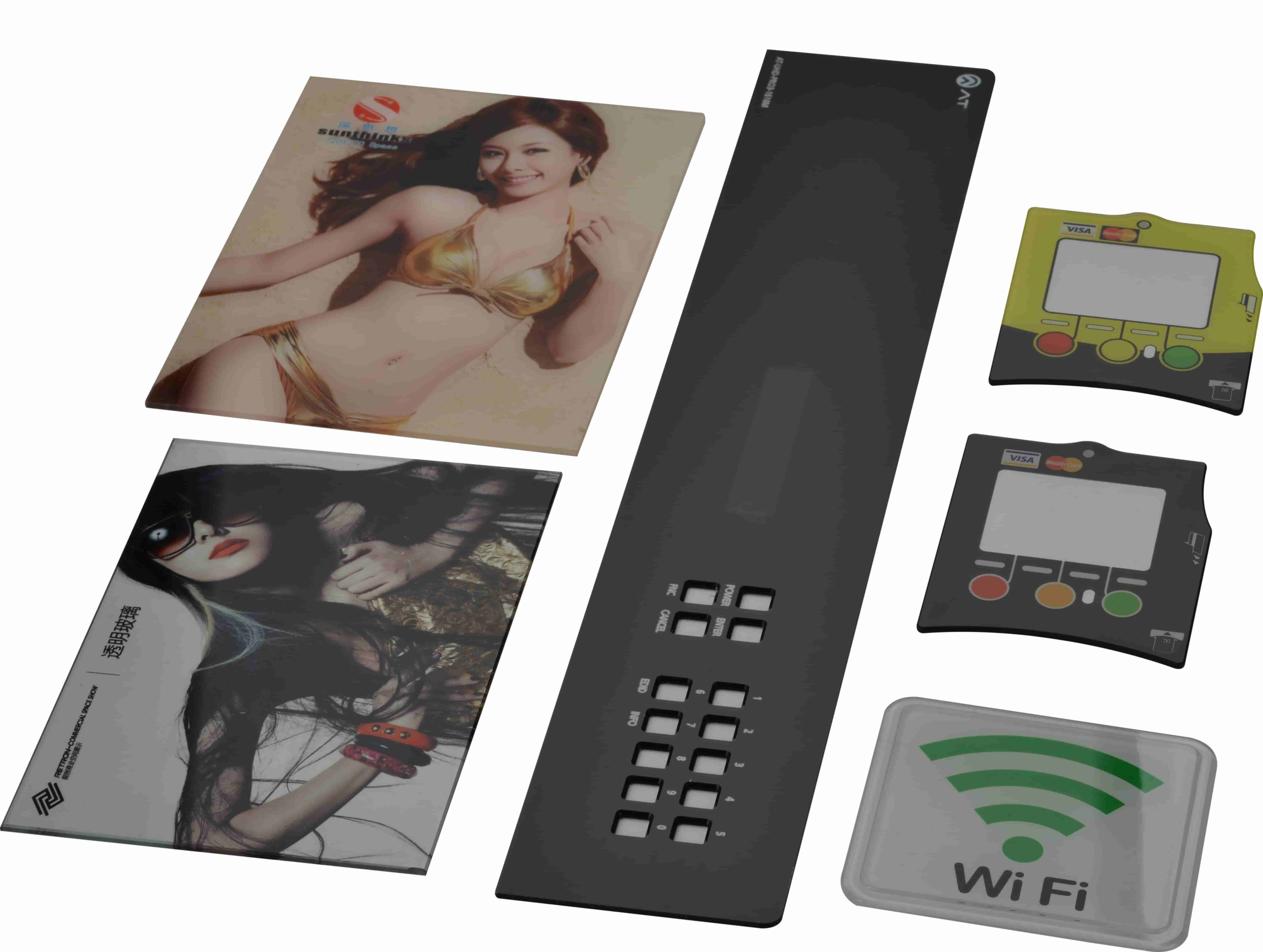 Verschiedene bedruckte Frontplatten mit Anzeigebereichen, Tastaturöffnungen, Porträts und einem WLAN-Symbol.